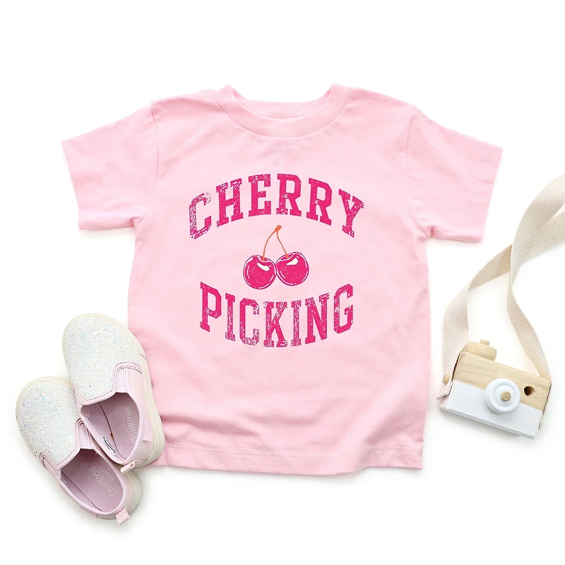 The Juniper Shop - Cherry Picking Varsity Arched Toddler Short Sleeve Graphic T-Shirt