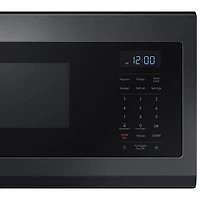Four à micro-ondes à hotte intégrée de Samsung - 1,1 pi³ - Acier inoxydable noir