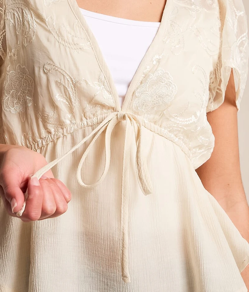 Embroidered Peplum Top