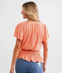 Plisse Peplum Top