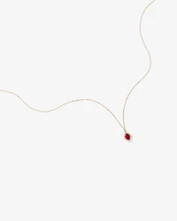 Oval Cut Created Ruby and Diamond Halo Pendant Necklace in 10kt Yellow Gold