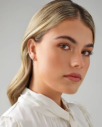 0,50 carat TW Boucles d'oreilles pendantes graduées en diamant en or jaune 18kt