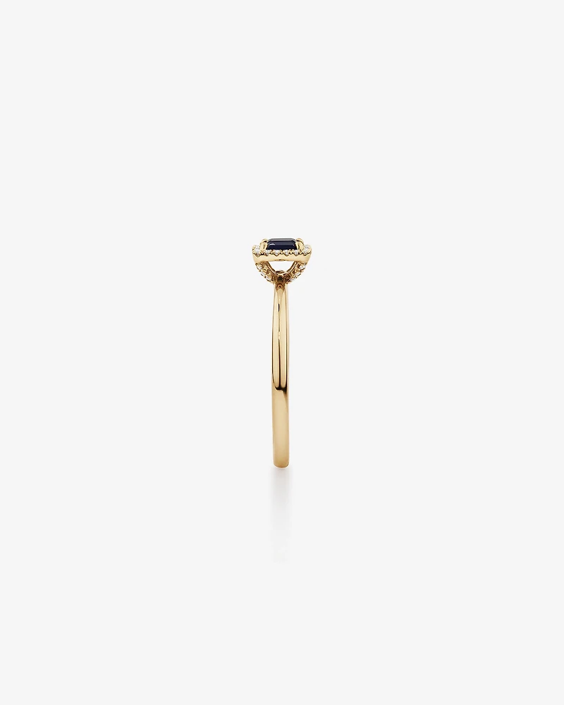 Emerald Cut Blue Sapphire Gemstone and 0.09 Carat TW Diamond Halo Ring in 10kt Yellow Gold