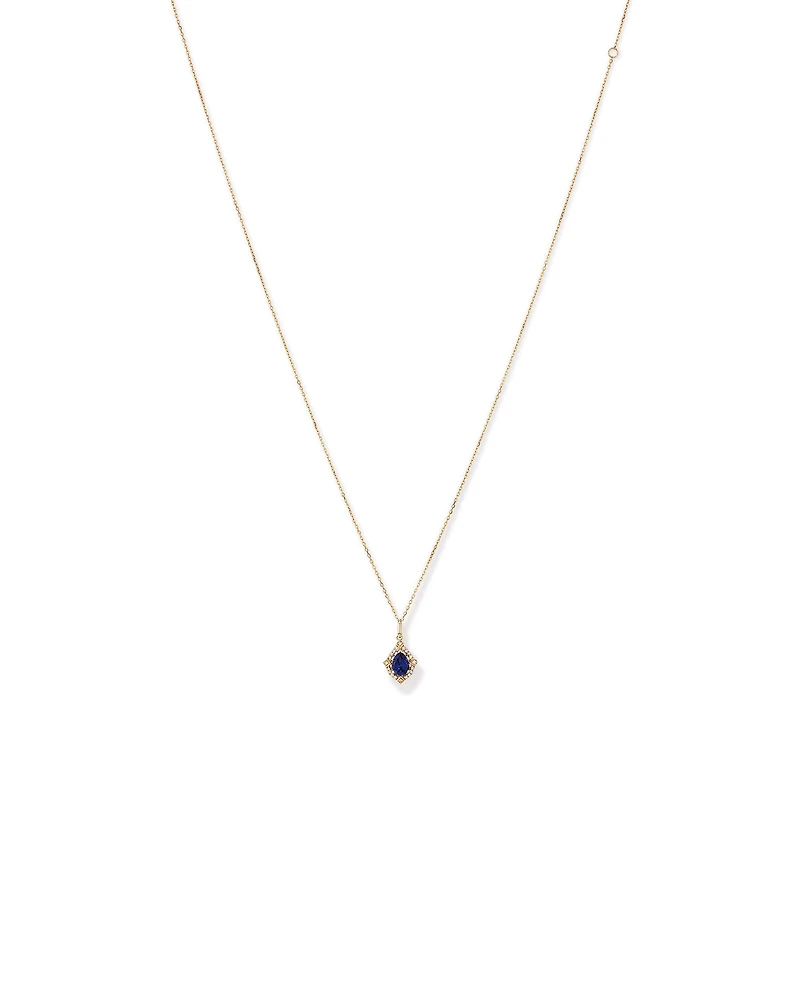 Pear Cut Created Sapphire and Diamond Halo Pendant Necklace in 10kt Yellow Gold