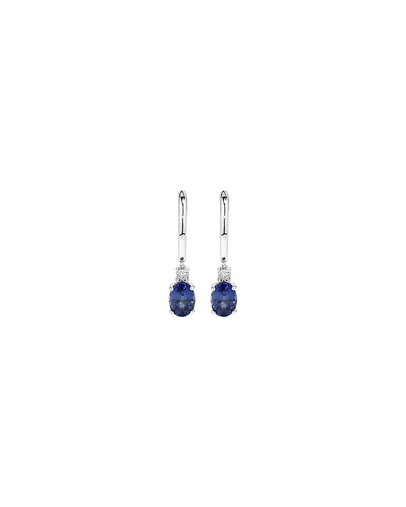 Oval Cut Blue Created Ceylon Sapphire Gemstone and Diamond Drop Huggie Earrings in Sterling Silver