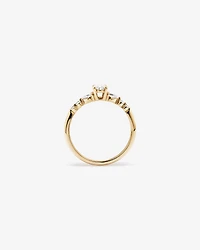 0.59 Carat TW Oval and Pear Sidestone Engagement Ring in 14kt Yellow Gold