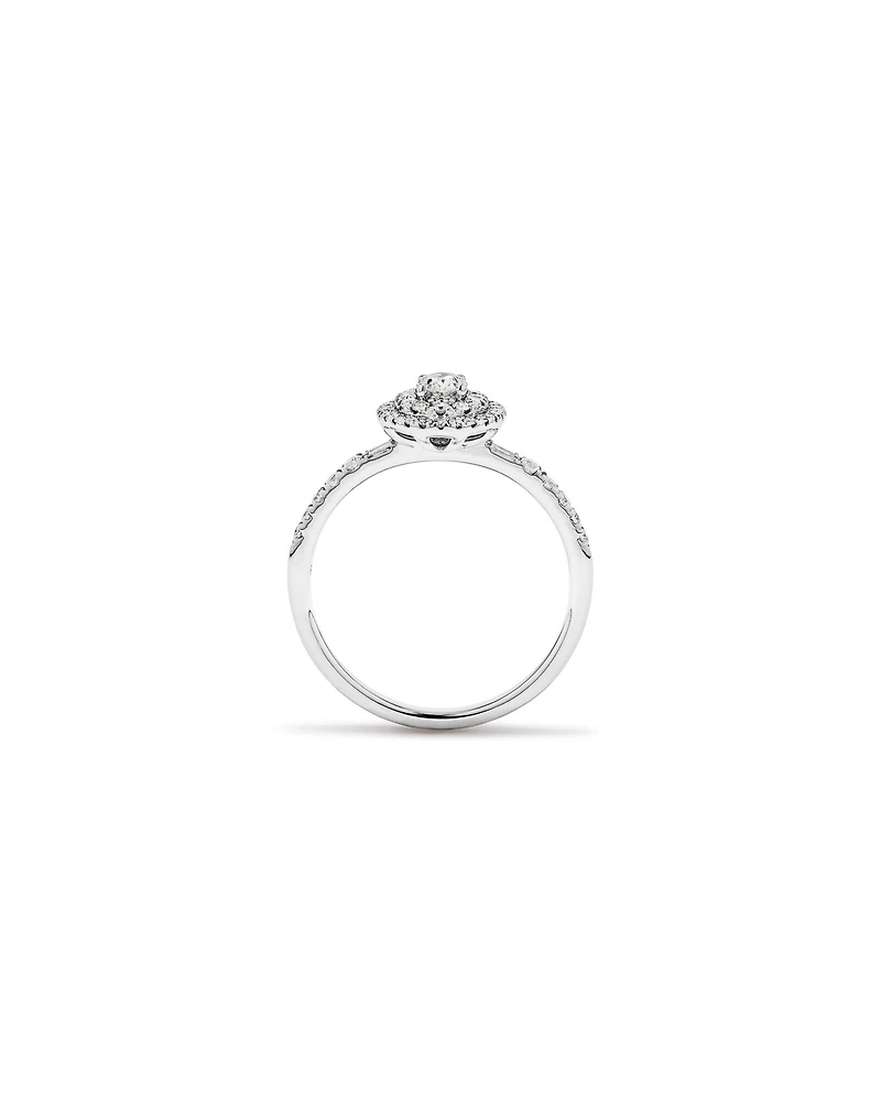 0.58 Carat TW Oval Diamond Halo Baguette Side Accent Engagement Ring in 14kt White Gold