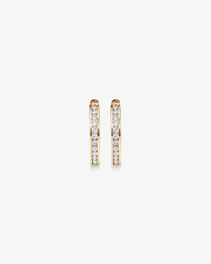 0.25 Carat TW Channel Set Round Brilliant Diamond Huggie Hoop Earrings in 10kt Yellow Gold
