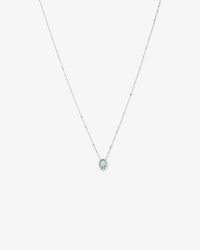 Oval Cut Blue Aquamarine Gemstone and 0.19 Carat TW Diamond Halo Pendant Necklace in 10kt White Gold