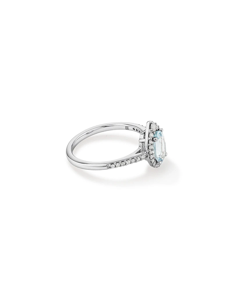Oval Cut Blue Aquamarine Gemstone and 0.29 Carat TW Diamond Halo Ring in 10kt White Gold