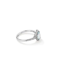 Oval Cut Blue Aquamarine Gemstone and 0.29 Carat TW Diamond Halo Ring in 10kt White Gold