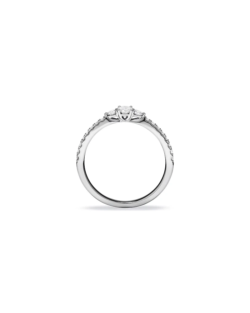 0.40 Carat TW Oval and Round Brilliant Three Stone Side Accent Engagement Ring in 14kt White Gold