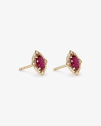 Oval Cut Created Ruby and Diamond Halo Stud Earrings in 10kt Yellow Gold