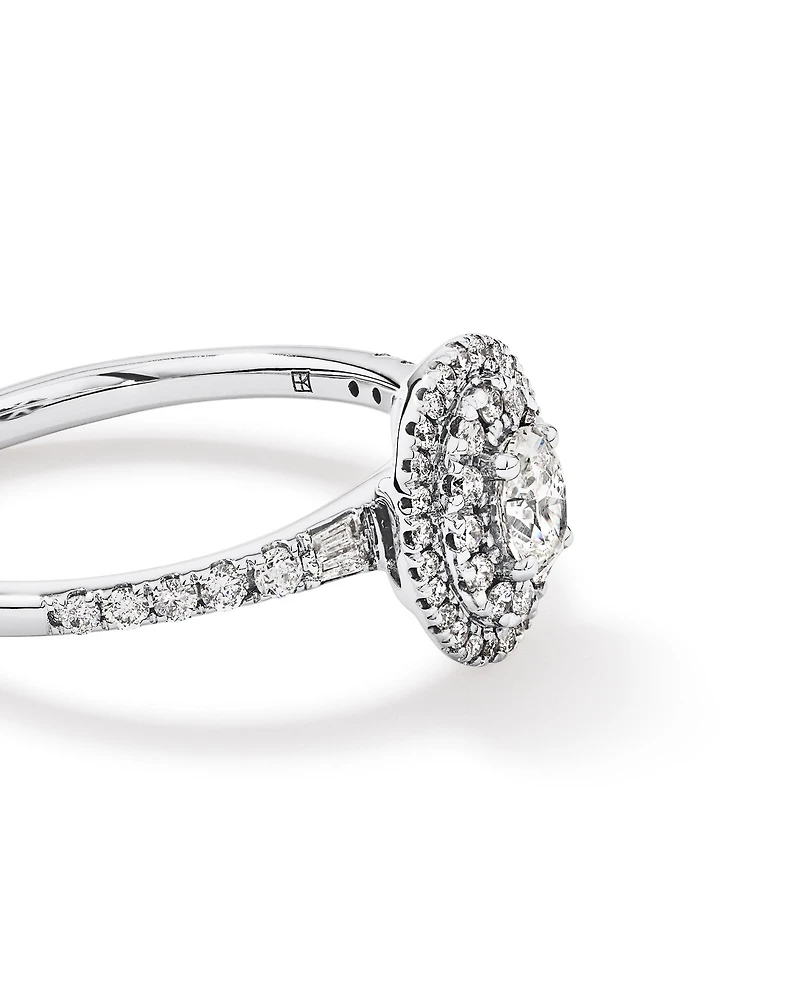 0.58 Carat TW Oval Diamond Halo Baguette Side Accent Engagement Ring in 14kt White Gold