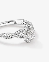 0.75 Carat TW Pear Cut Diamond Halo Twist Engagement Ring in 14kt White Gold