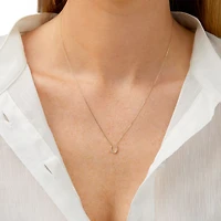 Collier à pendentif fer à cheval en or jaune 10 K avec diamants totalisant 0,10 ct