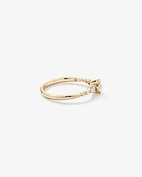 0.59 Carat TW Oval and Pear Sidestone Engagement Ring in 14kt Yellow Gold