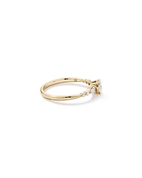0.59 Carat TW Oval and Pear Sidestone Engagement Ring in 14kt Yellow Gold