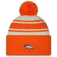 Denver Broncos New Era 2022 Cream NFL Sideline Sport Pom Cuffed Knit Beanie Hat