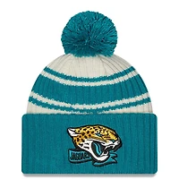 Jacksonville Jaguars New Era 2022 Cream NFL Sideline Sport Pom Cuffed Knit Beanie Hat
