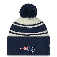 New England Patriots New Era 2022 Cream NFL Sideline Sport Pom Cuffed Knit Beanie Hat
