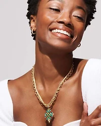 Ella Gold Huggie Earrings in White CZ