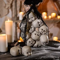 3 1/2" Halloween Plastic Doll Heads in Mesh Bag - 12 Pc.