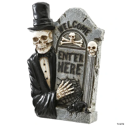 National Tree Company 12 in. Skeleton Holding Tombstone