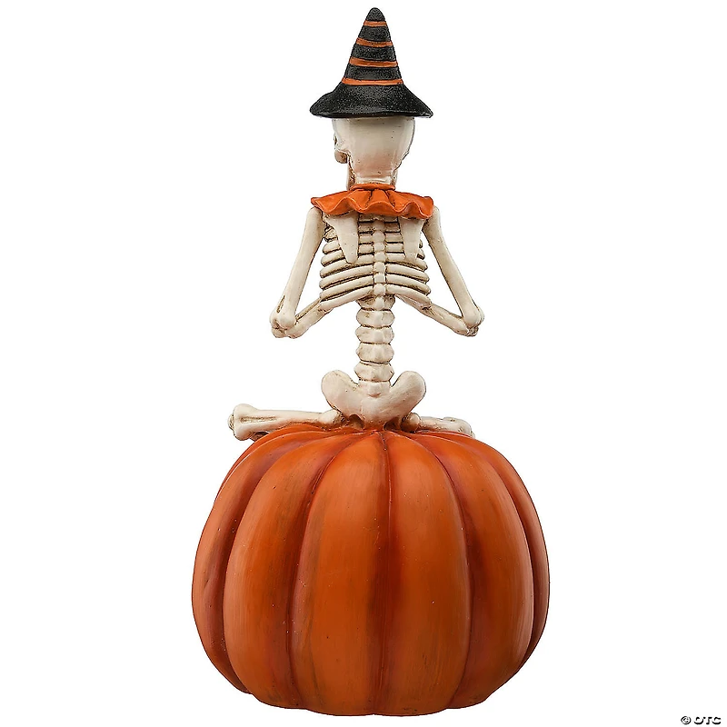 National Tree Company 12 in. Skeleton Sitting on Pumpkin