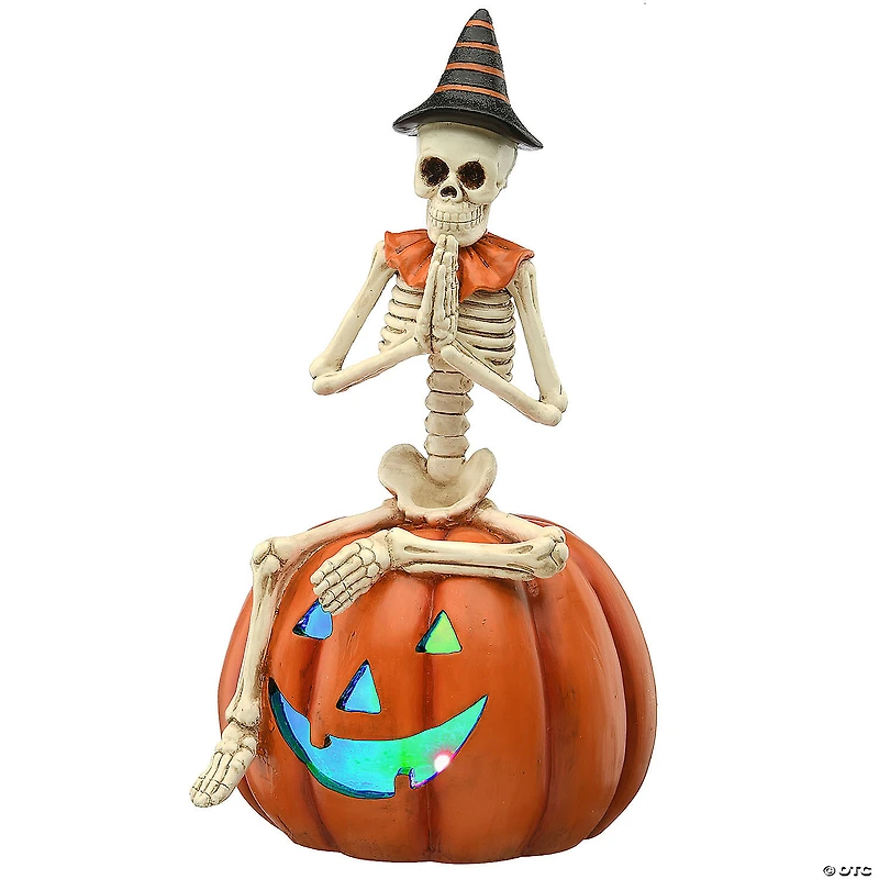 National Tree Company 12 in. Skeleton Sitting on Pumpkin