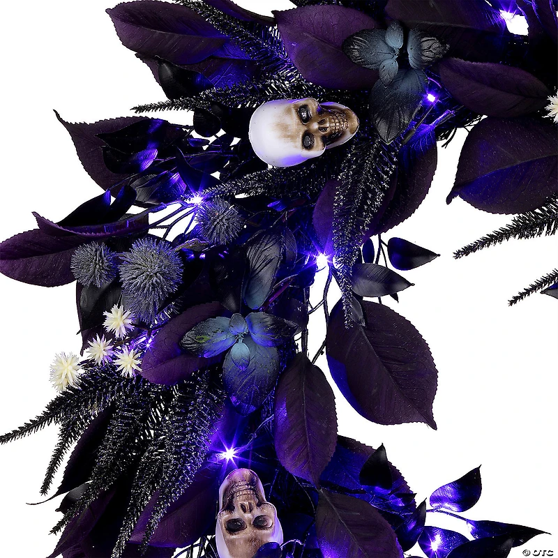 National Tree Company 26" Artificial Floral Mini Skull Wreath, 30 Purple LED Lights, Battery Operated