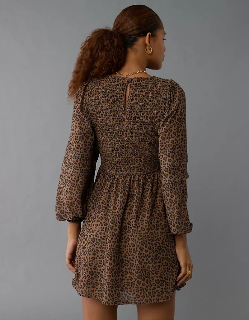 Mini-robe à mailles avec col haut et manches longues AE