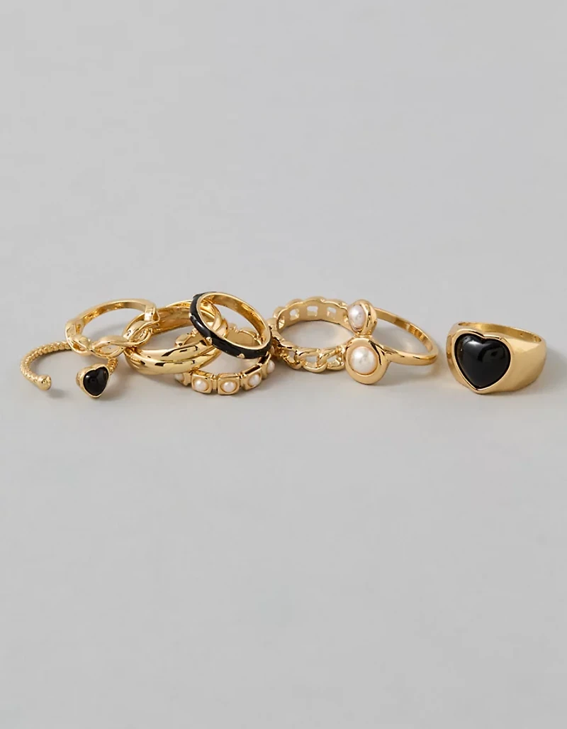 Emballage de huit bagues dorées et noires avec cœur AE