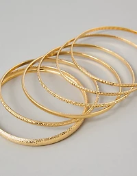 Ensemble de six bracelets joncs de ton doré AEO