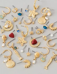 Ensemble de deux paires de clous d’oreille et initiale L AEO