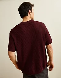 Polo en tricot boutonné et rayé AE