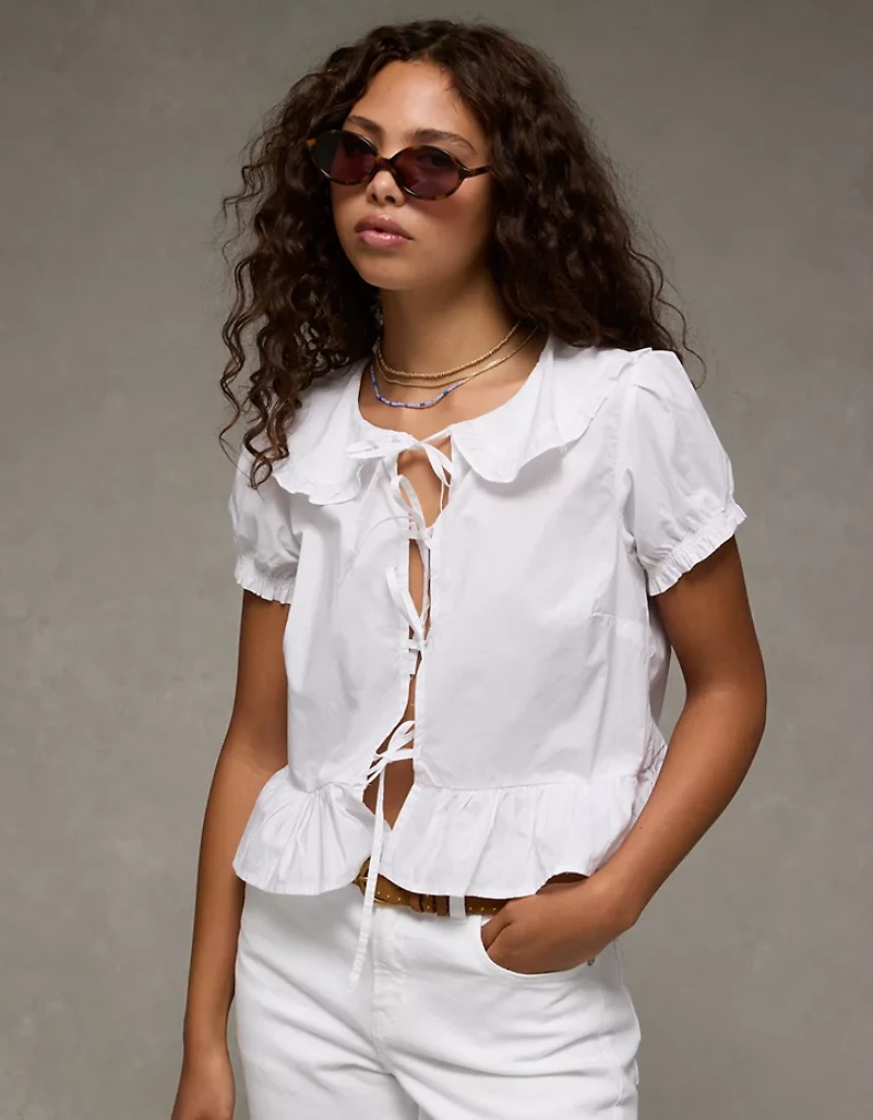 Blouse nouée à l’avant manches bouffantes et col AE