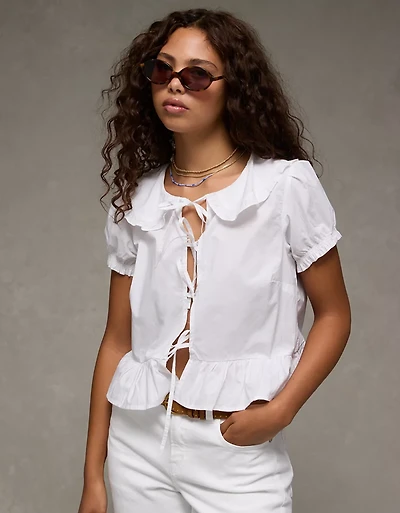 Blouse nouée à l’avant manches bouffantes et col AE