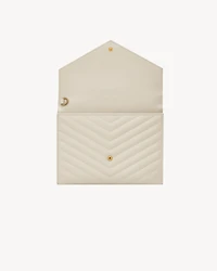 CASSANDRE MATELASSÉ FLAP POUCH in grain de poudre leather