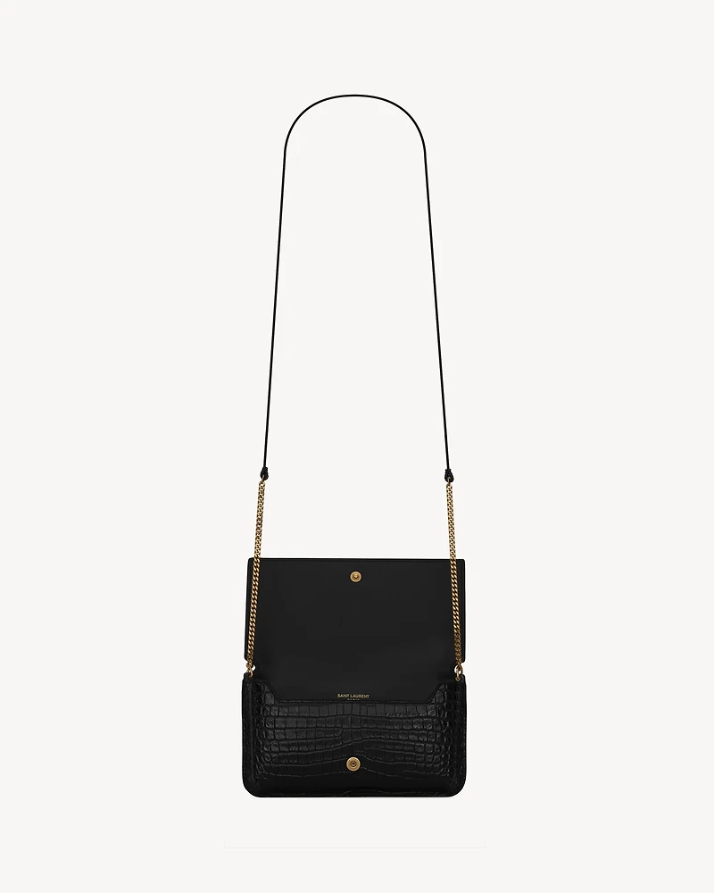 CASSANDRE phone holder in SHINY crocodile-embossed leather