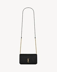 CASSANDRE phone holder in SHINY crocodile-embossed leather