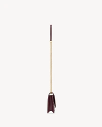CASSANDRE envelope chain wallet in patent leather