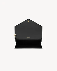 CASSANDRE flap pouch in crocodile-embossed shiny leather