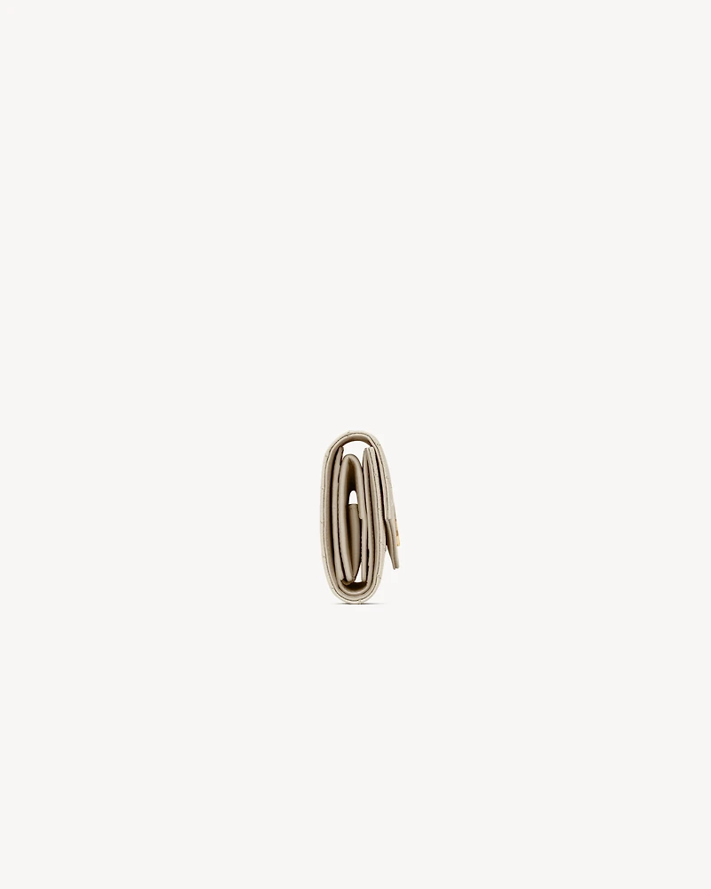 CASSANDRE MATELASSÉ MULTI-FOLDED WALLET IN GRAIN DE POUDRE LEATHER
