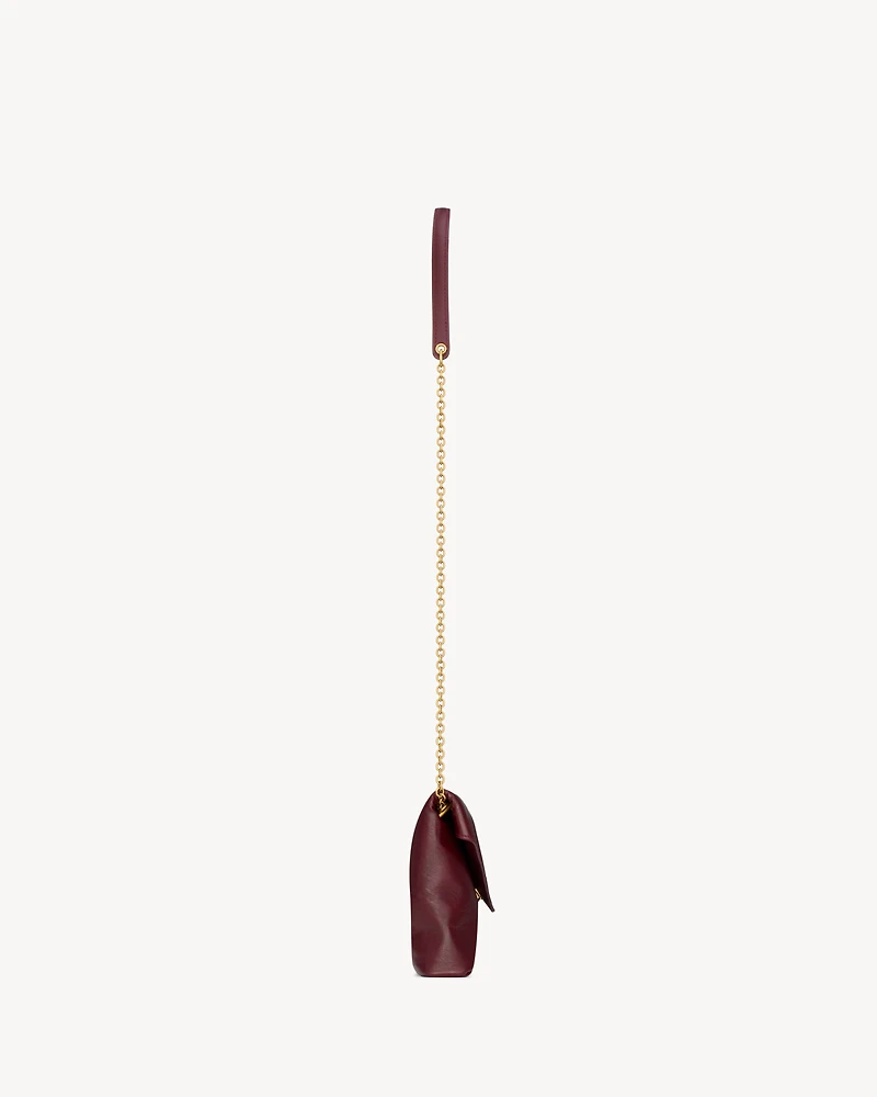 CASSANDRE chain pouch in shiny leather