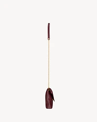 CASSANDRE chain pouch in shiny leather