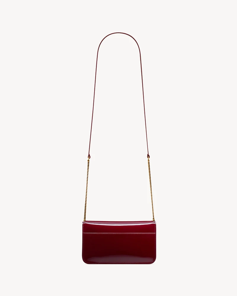 CASSANDRE phone holder in patent leather
