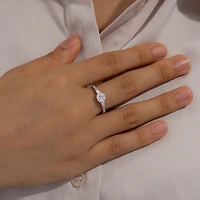 Diamonart Womens Cubic Zirconia Sterling Silver Round Side Stone Engagement Ring