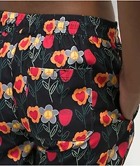 Petals by and Peacocks Flower Print Black Board Shorts