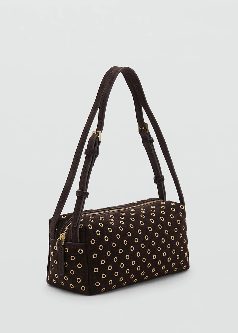 Suede shoulder bag with eyelets